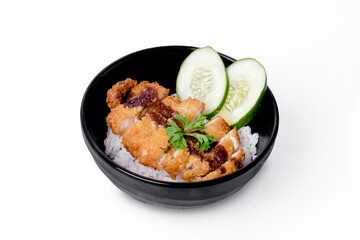 Wall Mural - Fried chicken Cutlet with rice in black bowl isolated on white background.