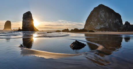 Wall Mural - USA, Oregon. Cannon Beach with Haystack near sunset and low tide.