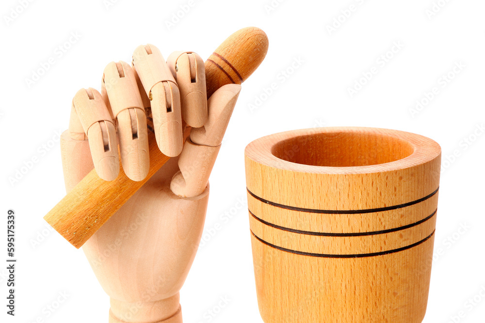 Wooden hand with mortar and pestle on white background