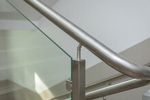 Round Handrail From The Balustrade On The Staircase In The Building.