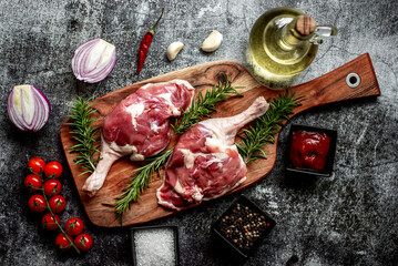 Wall Mural - raw duck legs on stone background