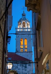 Poster - Historic Bell tower of St. Mark's cathedral in the old town of Korcula in Croatia at night