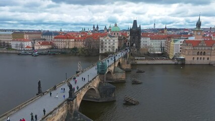 Wall Mural - Scenic spring panoramic aerial view of the Old Town pier architecture and Charles Bridge over Vltava river in Prague, Czech Republic