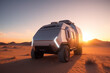 Modern futuristic hydrogen truck in the desert during sunrise, front view of the truck, mountain range in the background