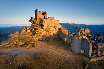 Sticker - an old castle is perched on a rocky hill overlooking the mountains