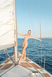 © olly - young woman on a sailboat