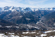 view of Oulx city in the mountains (Susa Valley, Piedmont, Italian Alps) in winter with snow