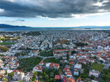 Fototapeta Miasto - Aerial view over The old historical center of Kalamata seaside city, Greece by the Castle of Kalamata