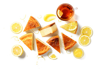 Wall Mural - Slices of fresh baked homemade lemon cheesecake with lemon curd and lemon slices. isolated on white background, top view