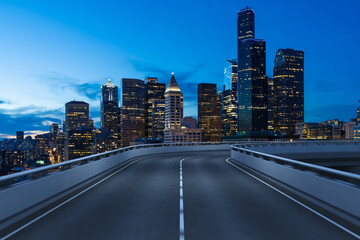 Empty urban asphalt road exterior with city buildings background. New modern highway concrete construction. Concept way to success. Transportation logistic industry fast delivery. Seattle. USA.