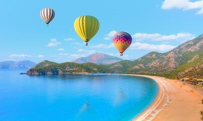 Wall Mural - Hot air balloon flying over spectacular oludeniz (ölüdeniz) lagoon - Fethiye, Turkey