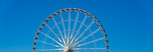 Part Of Ferris Wheel In The Blue Sky