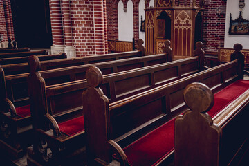 Wall Mural - Rows of church benches at the old european catholic church.