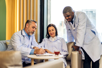 Group of professional medical doctor team meeting training medical in uniform working discussing and talk with patients record, teaching medic team, sit in hospital.health medical care concept