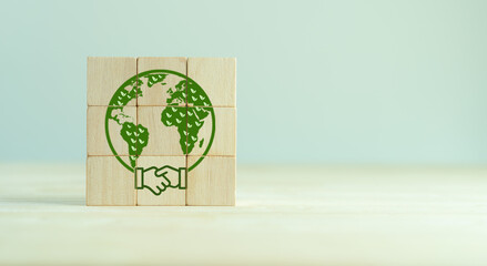 Wall Mural - Save of earth, environment protection icons on wooden blocks. World earth day, world environment day. Encouraging worldwide awareness and action to protect environment. Environmental sustainability.