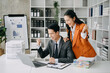 © Nuttapong punna - Young Asian business team creative businesspeople coworker, teamwork celebrating achievement and in planning design in creative in office.