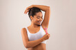 © Prostock-studio - Young african woman shaving armpits, using razor