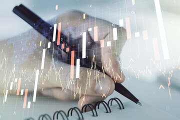 Poster - Multi exposure of abstract financial graph with world map and with man hand writing in diary on background, financial and trading concept