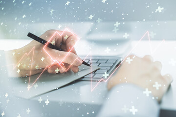 Poster - Creative abstract heart pulse hologram and hand writing in diary on background with laptop, online medical consulting concept. Multiexposure
