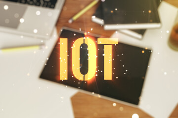 Poster - Creative IOT hologram and modern digital tablet on background, internet of things concept. Multiexposure