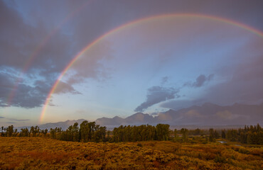 Poster - Autumn Landscape in the Tetons in a Storm with Rainbow