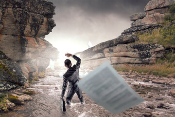 Wall Mural - young businessman standing and rock mountain
