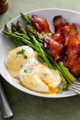 Wall Mural - Healthy breakfast with poached eggs, bacon and asparagus