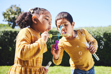 playing, garden and children blowing bubbles for entertainment, weekend and fun activity together. r