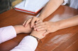 © Nina - Woman supportive psychologist provide mental aid to patient at session, professional help concept, mental health. Patient consultation. Close up of hands