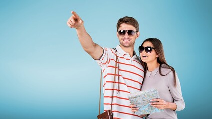 Canvas Print - Happy couple of tourist posing on background.