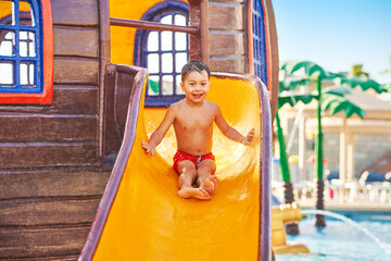 Picture of young boy playing in outdoor aqua park