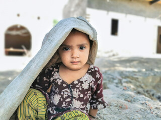 young refugee little girl playing