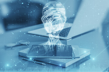 Poster - Close up of desktop with cellphone, laptop, supplies and abstract digital fingerprint man or person silhouette on blurry background. Identity, technology and secure concept. Double exposure.
