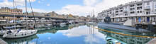 Panoramic View Of Genoa Marina, With Submarine, Boats, Buildings And Nice Reflection