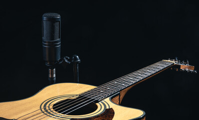 Wall Mural - Close up of a classical light guitar and microphone, low key.