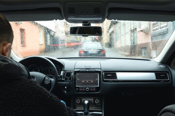 Wall Mural - Hands on the wheel when driving at high speed from inside the car.