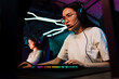 © Drobot Dean - Asian girl playing online video game in cybersport club