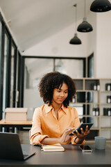 Business woman using tablet and laptop for doing math finance on an office desk, tax, report, accounting, statistics, and analytical research concept in office