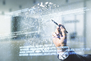 Poster - Man hand with pen working with abstract virtual code skull illustration on blurred office background. Hacking and phishing concept. Multiexposure