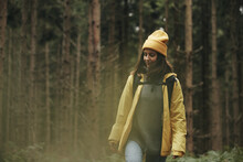 Smiling Woman Hiking In A Forest