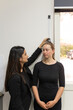© Austockphoto - woman's height being measure by another woman using a height ruler while at doctors