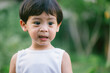 Asia boy he mouth aftertaste from eating chocolate ice cream  or chocolate dessert. A sweet-toothed child eat chocolate.