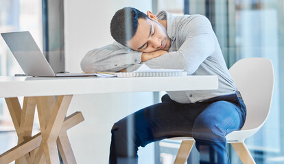 Poster - The boss will never know. an exhausted young businessman taking a nap at his desk.