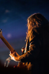 Wall Mural - Band playing music and a gig in a venue, close up of a rock band playing guitars and instruments.