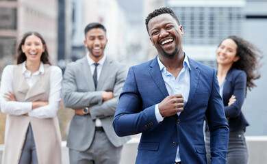 Poster - Were shimmying our way to success. Portrait of a confident young businessman standing in the city with his colleagues in the background.