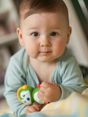 Wall Mural - Portrait of cute baby boy looking at camera. Joy and happiness concept. Love and family emotion