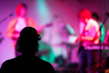 Sticker - Band playing music and a gig in a venue, close up of a rock band playing guitars and instruments.