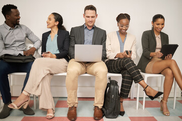 Poster - Were all here for a reason. a group of businesspeople waiting in line at an office.