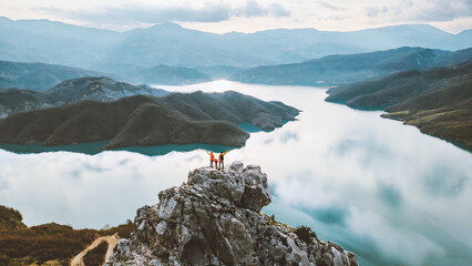 Wall Mural - aerial view family hiking in albania parents with child travel outdoor enjoying bovilla lake view ac