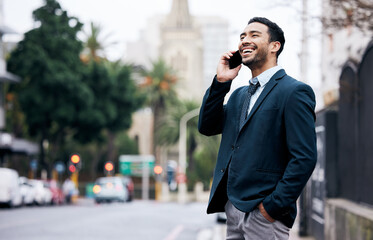 Aufkleber - Build your own dreams or someone else will. a handsome young businessman standing in the city and using his cellphone.